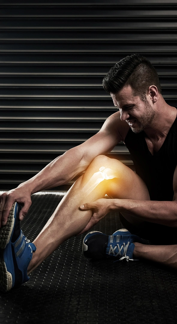 Athlete receiving knee treatment